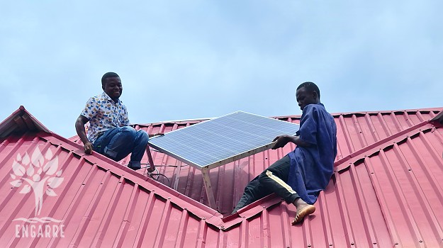 africans installing solar panel