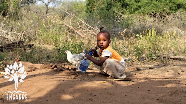 african child with water bottle