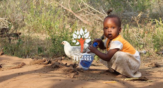 african child with water bottle